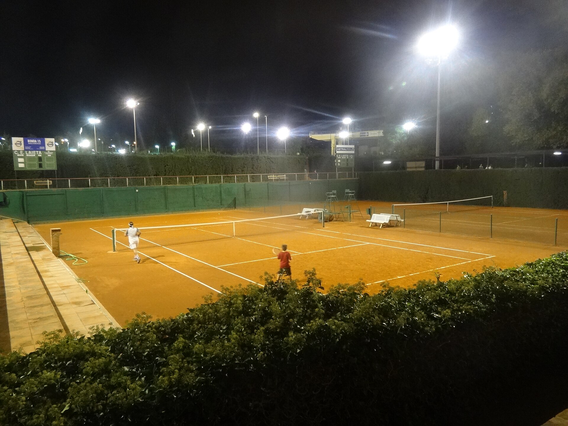 Courtside at a floodlit match